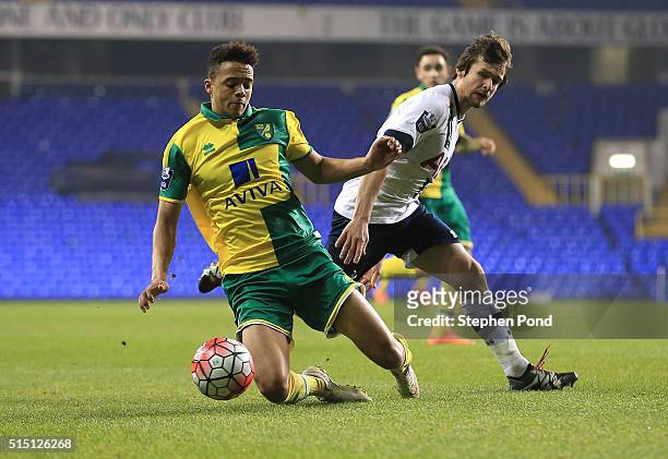 Filip Lesniak of Tottenham Hotspur and Jamal Lewis of Norwich City compete for the ball during the Barclays U21 Premier League match between...