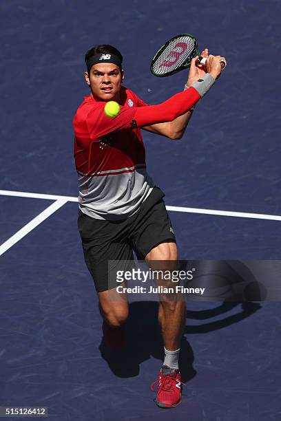 Milos Raonic of Canada plays a backhand volley in his match against Inigo Cervantes of Spain during day six of the BNP Paribas Open at Indian Wells...