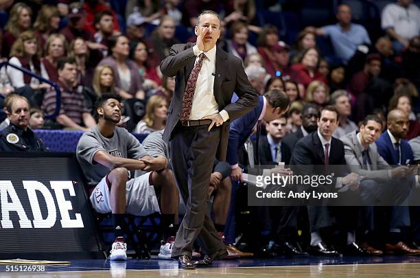 Billy Kennedy the head coach of the Texas A&M Aggies gives instructions to his team in the game against the LSU Tigers during the semifinals of the...