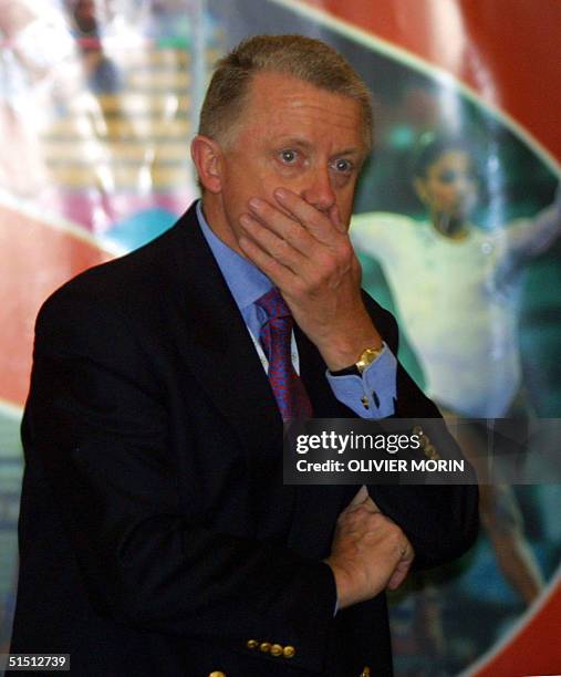 Dutch International Olympic Comittee member and Cyclist International Union president Hein Verbruggen carefully follows 14 July 2001 the 112th...
