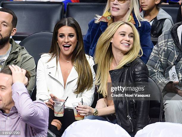 Lea Michele and Becca Tobin attend a basketball game between the New York Knicks and the Los Angeles Clippers at Staples Center on March 11, 2016 in...