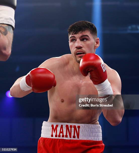 Artur Mann of Germany fights during the cruiserweight fight against Bjoern Blaschke of Germany at Jahnsportforum on March 12, 2016 in Neubrandenburg,...