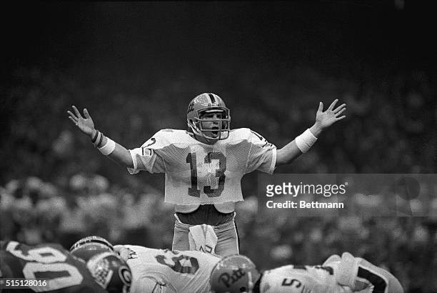 Pittsburgh Panthers quarterback Dan Marino, #13, uses his hands to try to tell the Sugar Bowl crowd to be quiet during a drive to score in the second...