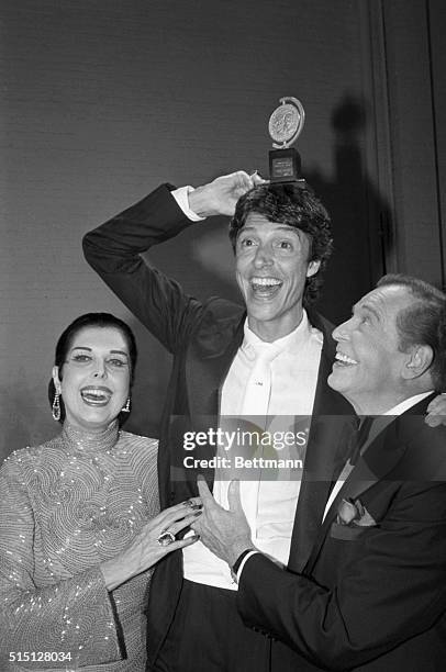 New York, NY- Tommy Tune clowns around with the Tony Award he won 6/6 as best director for the Broadway musical "Nine". The show won five awards...