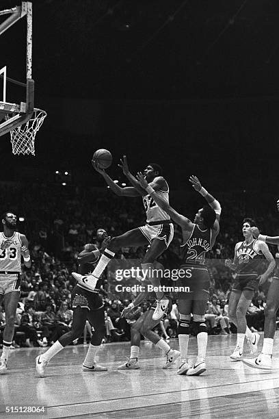 Los Angeles Lakers Magic Johnson goes for a lay up as Phoenix Suns Dennis Johnson tries to stop Magic at the Forum. Johnson added 23 points for the...