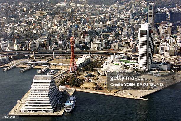 An aerial view of a port and skyscrapers in downtown Kobe, Japan, 24 May 2001. The city is one of the host cities for the World Cup in 2002. AFP...