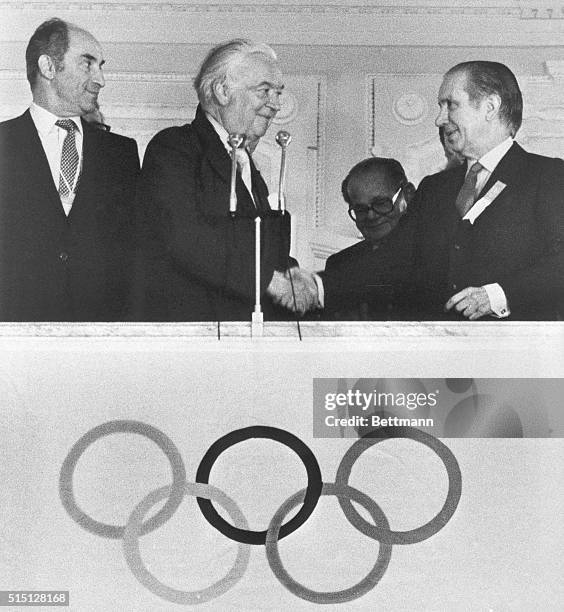 Juan Antonio Samaranch is congratulated by outgoing IOC President Lord Killanin here 7/16 after being elected new President of the International...