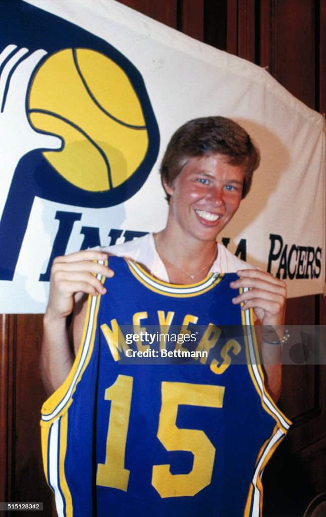 Woman Holding Basketball Shirt