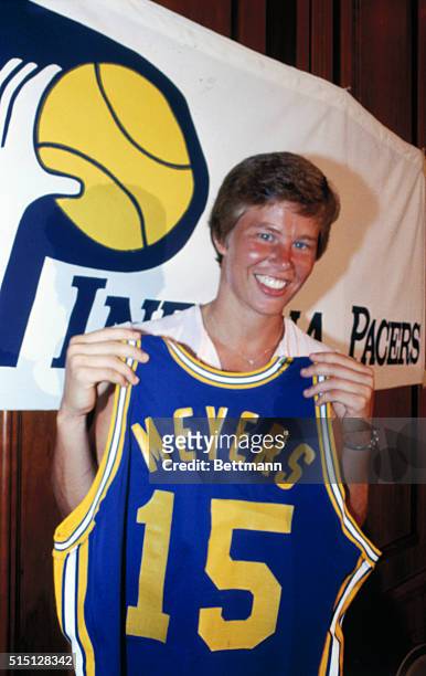 Los Angeles, California: Olympian and UCLA basketball star, Ann Meyers, holds up an Indiana Pacers shirt with Number 15, the number she wore while...