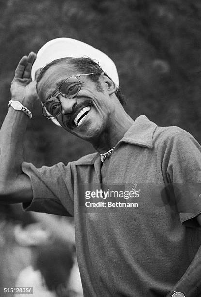 Wethersfield, Connecticut: Sammy Davis, Jr., whips off his cap pleased with his tee shot off the 1st of the Greater Hartford Open, July 23, at the...