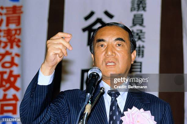 Nakasone Yasuhiro, Japanese Liberal Democratic Party leader, speaking at microphone.