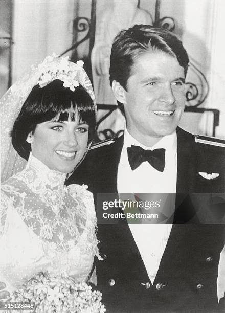 Beverly Hills, California: Olympic gold medalist Dorothy Hamill and Dean Paul Martin pose for cameras after they were married 1/8 at All Saints...