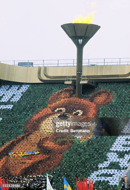 Moscow, Russia-ORIGINAL CAPTION READS: Sergei Belov, Soviet basketball coach, ignites the Olympic torch at Lenin Stadium during ceremony opening the...