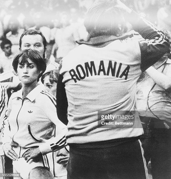 Moscow: Nadia Comaneci draws a blank expression as Romanian coach Bela Karolyi reacts with disbelief after a row between Olympic judges that cost...