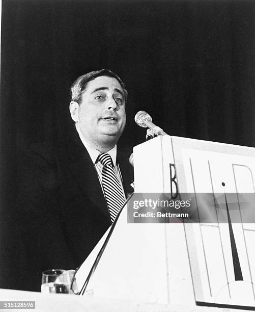 Fred Silverman, President of NBC giving a speech from a podium.