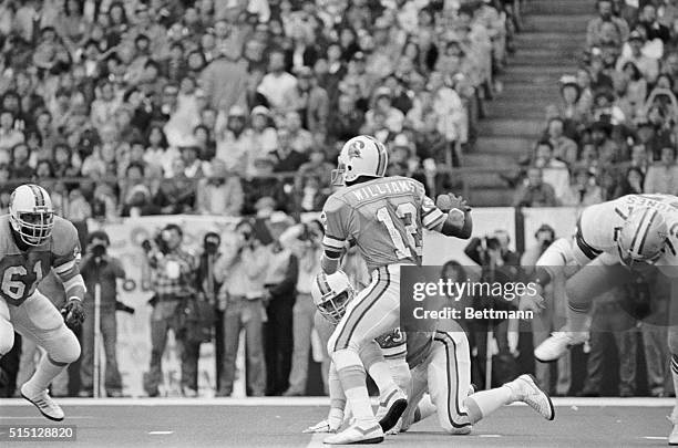 Irving, Texas: Dallas Cowboys' Ed "Too Tall" Jones sails past Tampa Bay QB Doug Williams in the first quarter as the Cowboys' defensive unit puts the...