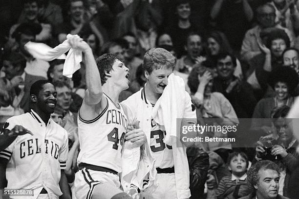 Nate Archibald , Danny Ainge and Larry Bird whoop it up on the bench after the Celtics defeated the Pistons, 125-104, for their 18th consecutive win...