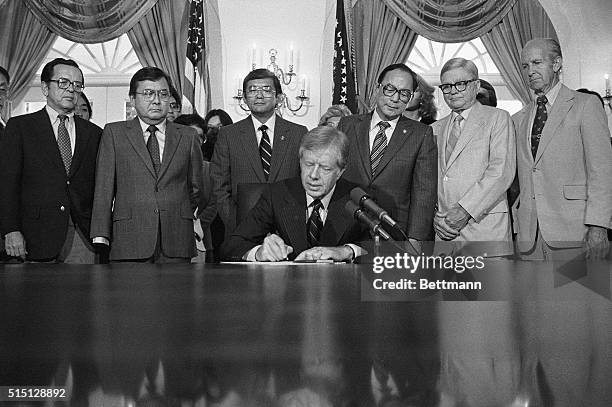 Washington, DC- In ceremonies at the White House, President Jimmy Carter signs a bill creating a commission to look into the wartime internment of...