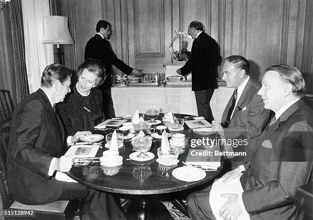 London, England: Seen at breakfast at No. 10 Downing Street are left to right: President Reagan, Prime Minister Thatcher, Secretary of State...