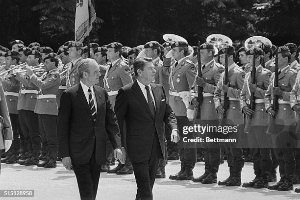 Bonn, West Germany: President Ronald Reagan and West German president Karl Carstens review Bundeswehr honor guard during official welcome ceremony.