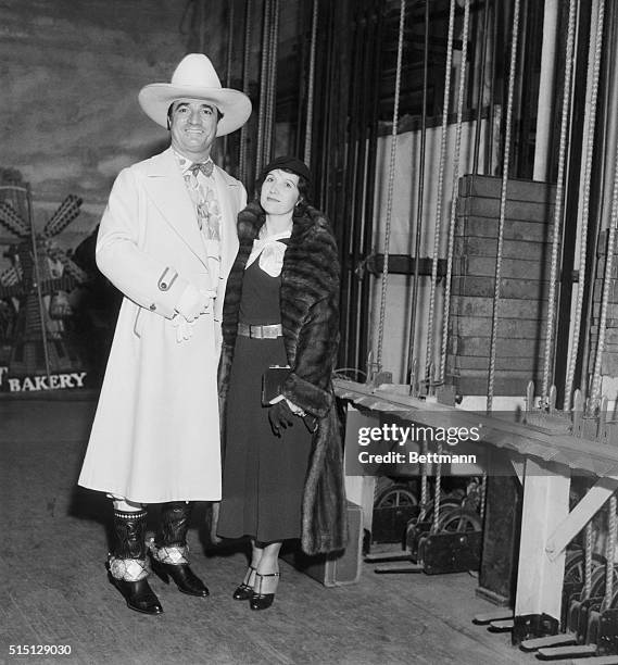 Film Folk at Benefit Show. Mr. And Mrs. Tom Mix are seen here at the Christmas Benefit Show, staged by a Los Angeles Newspaper, at the Shrine Civic...