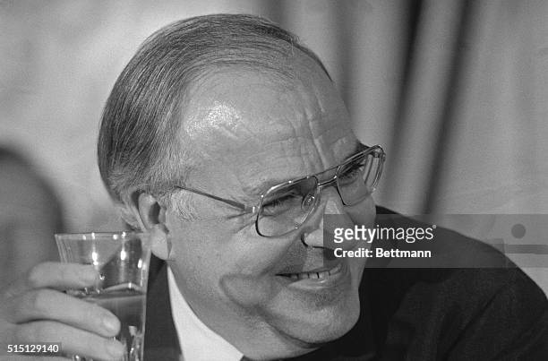 Luxembourg: West German chancellor Helmut Kohl grins after he stated "I do not come here as Santa Claus" to a reporter's question regarding further...