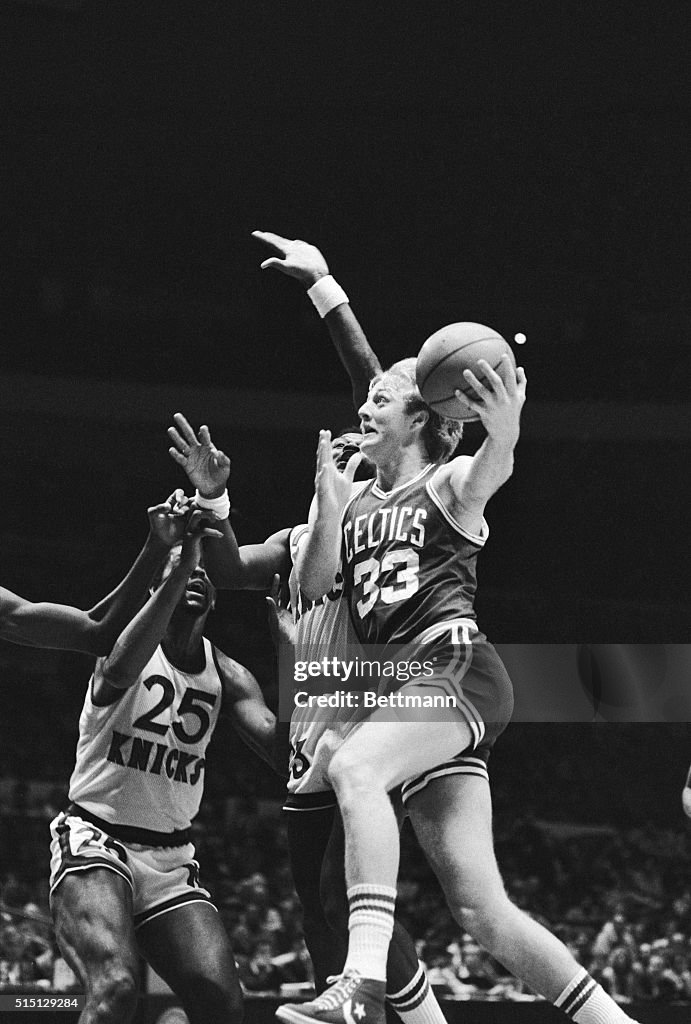 Larry Bird Dunking Basketball During Game