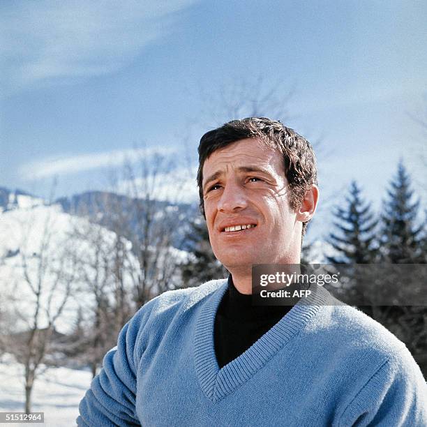 Jean-Paul Belmondo, one of France's biggest screen stars and a symbol of 1960s New Wave cinema, smiles at the photographer in the 1960s during his...