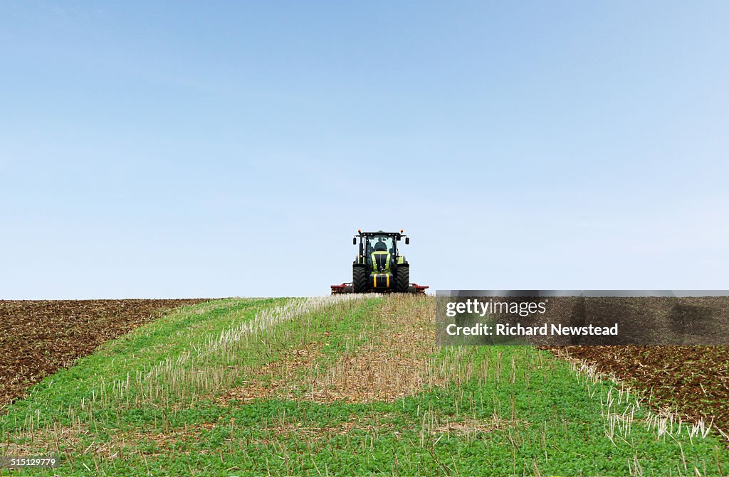 Farmer Ploughing Field
