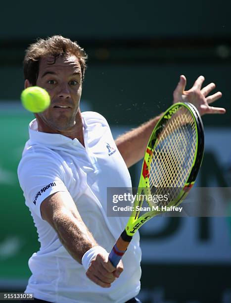 Richard Gasquet of France returns a shot against Nicolas Mahut of France during the BNP Paribas Open at the Indian Wells Tennis Garden on March 11 at...