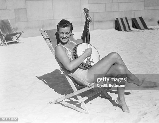 Los Angeles: Musical Mermaid. After equaling her world backstroke record of 1:11.2 for the 100 yards, pretty Eleanor Holm celebrates by plinking a...