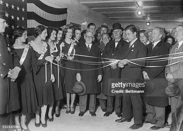On your mark-ready to be the first to walk through new subway tunnel built by Bloomingdales under Lexington Ave. At 59th St., Al Smith stands between...