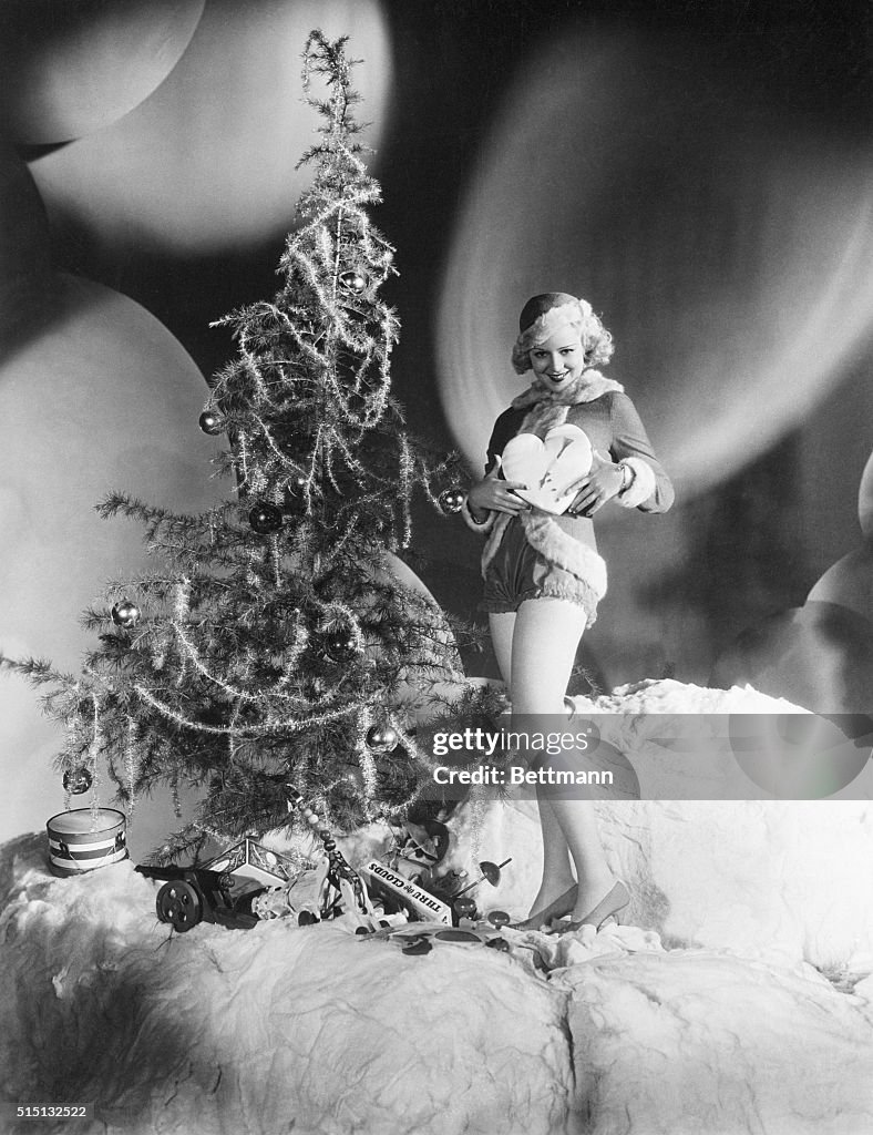 Claire Trevor Poses with Heart and Tree