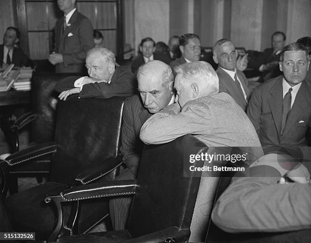 John Pierpont Morgan Jr., New York financier and banker, receives some whispered advice from his attorney, John W. Davis , during the second day of...