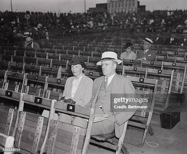 Amelia Earhart Putnam, and her husband, George Palmer Putnam, well-known publisher, pictured as they attended the world championship bout between...