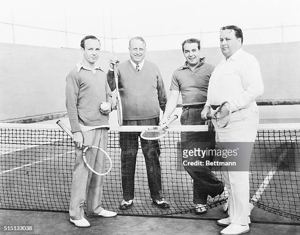 Hearst Foursome. A rare photograph showing William Randolph Hearst, well-known publisher, with three of his five sons on the tennis courts of the...