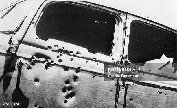Bullet holes in the V-8 sedan in which Clyde Barrow, Southwest desperado, and his woman companion, Bonnie Parker, were shot to death near Arcadia,...