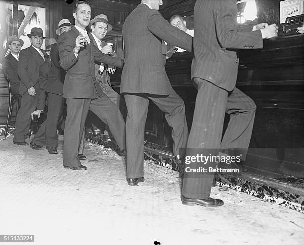 May 21, 1934 - New York: Although official announcement had set no hour to mark the legality of drinking hard liquor at bars in New York State, a...