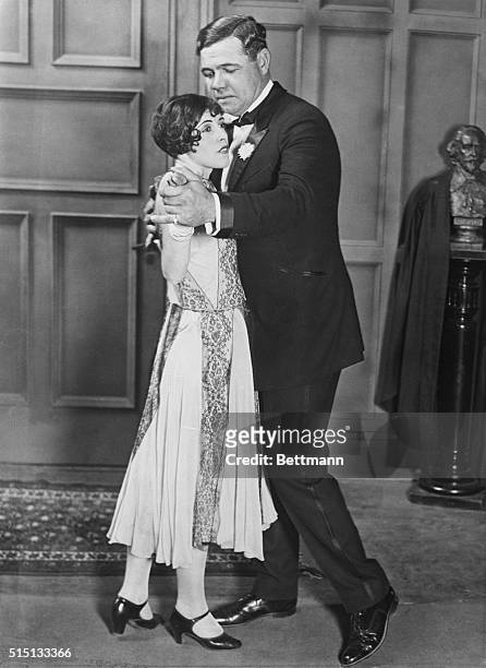 Famous home run hitter Babe Ruth dances with Hazel Roland while he is in Los Angeles to pursue a possible career as a film actor.