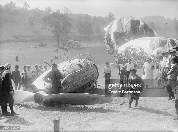 Photo shows people picking up souvenirs of the wrecked Shenandoah.