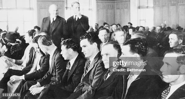 This row of men are on trial in Federal Court in Dallas, Texas, charges with aiding and concealing Clyde Barrow and Bonnie Parker, killers who were...