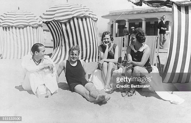 The Pickfords Have Guests at Deauville: Deauville, France: Photo shows left to right, Jack Pickford, Erskine Gwynne, Mrs. Pickford and Mrs. Frieda...