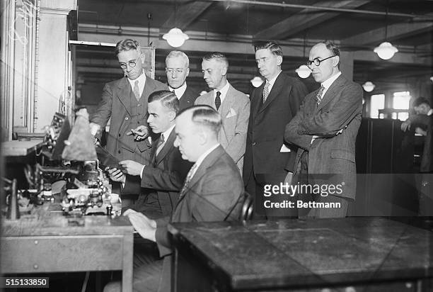 Photo shows the officials of the Western union Telegraph Company and of the Associated Press Witnessing the reception of the Locarno Peace Treaty...