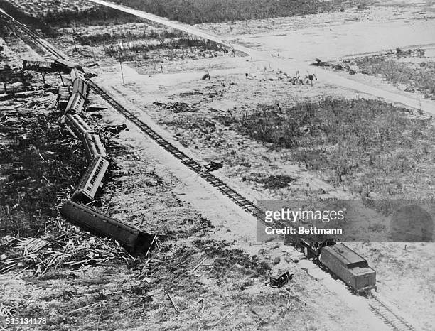 All but the engine of this Florida East Coast Emergency Relief train was blown from the tracks by the hurricane, just below Snake Creek, near...
