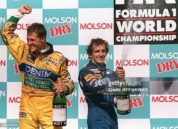 Photo taken 13 June 1993 shows French driver Alain Prost and German driver Michael Schumacher , celebrating their first and second places...