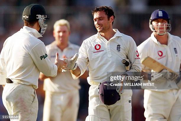 England batsman Mark Ramprakash is congratulated by Australia's Justin Langer after scoring his century as Shane Warne and Darren Gough look on on...