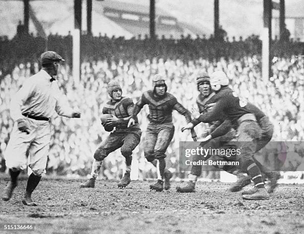 The New York Giants vs. The Chicago Bears at the Polo Grounds in this photo. Red Grange is shown at left, about to make a pass.