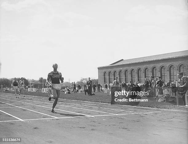 Jesse Owens, Ohio State track marvel, shown as he won the 220-yard dash, beating the world's record by 3/10 of a second, and his nearest competitor,...