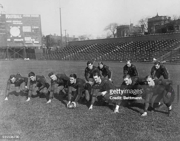 This is the first photo show "Red" Grange, ace of football, in a professional line for the Chicago Bears. From left; George Halas; Murray; McMillan;...