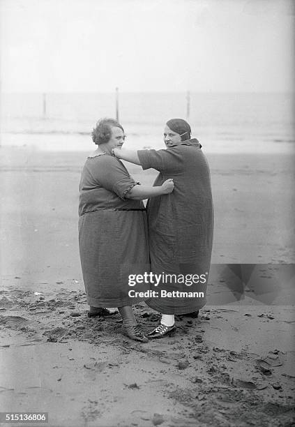 Overweight women sparring at beach. November 02, 1925